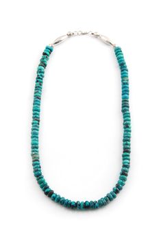 This beautiful Turquoise and Sterling Silver Necklace has a single strand of rondelle shaped genuine turquoise beads. Deep turquoise stones containing their natural black matrix are strung together for a dramatic look. Take a close look at the colors of this turquoise. In traditional Navajo fashion, handmade sterling silver beads and clasp hold the strands together. This is a very versatile and comfortable necklace which will be perfect for any occasion. 20" Long Stamped Sterling Navajo Fashion, Deep Turquoise, Silver Eagles, Dramatic Look, Turquoise Stones, Genuine Turquoise, Turquoise Beads, Handmade Sterling Silver, Sterling Silver Bead