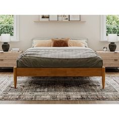 a bed sitting on top of a wooden frame