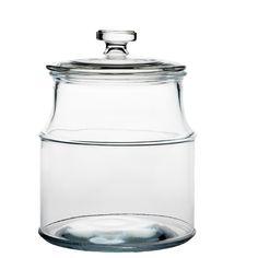 a glass jar with a metal lid on a white background and water in the bottom