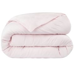 the pink comforter is folded on top of each other