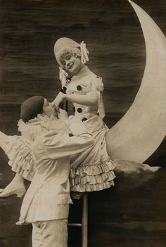 an old black and white photo of a woman sitting on the moon