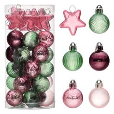 assorted christmas ornaments in glass containers with pink and green baubles on white background