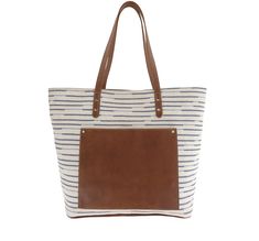 This trendy textile tote features a rich, full grain leather trim, plus leather bottom and straps for long-lasting wear. The spacious interior provides two zippers and accessory pockets, while a distinctive exterior leather pocket separates Shelby from your everyday totes, and keeps your phone and keys more readily at hand.
Handcrafted in the U.S.A. (15.00"W, 12.00"H, 6.00"D) Leather Satchel With Canvas Lining For Shopping, Brown Tote Bag With Canvas Lining, Everyday Coated Canvas Bags With Handles, Chic Shoulder Bag With Double Handle And Canvas Lining, Top Handle Canvas Bag With Leather Handles, On-the-go Satchel Bag With Leather Trim, Canvas Lined Tote Bag For Shopping, Canvas Travel Satchel, Canvas Shopping Bag With Leather Handles