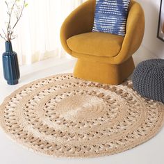 a living room with a chair and rug