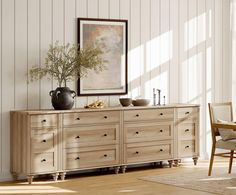 a large wooden dresser sitting next to a chair in a room with white walls and wood flooring