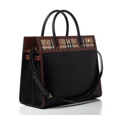 Burberry Calfskin Leather Top Handle Check Mini Black Handbag Bag Italy New This Is An Authentic Burberry Calfskin Vintage Check Two Handle Title Tote In Black. This Stylish Tote Is Crafted Of Finely Calfskin Leather In Black. The Bag Features Rolled Leather Top Handles, An Optional Adjustable Shoulder Strap With Gold Hardware, And Burberry House Check Canvas Panels. The Top Is Open To A Partitioned Burberry House Check Fabric Interior With Zipper And Patch Pockets, And Plenty Of Room For Daytim Burberry Aesthetic, Burberry Purse, Handbag Boutique, Burberry Tote, Black Leather Top, Leather Roll, Black Handbag, Check Fabric, Monogrammed Leather