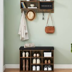 a coat rack with shoes and hats on it next to a wall mounted shelf filled with personal items