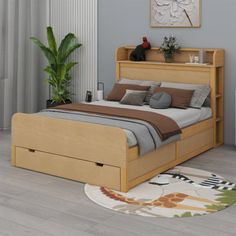 a bed sitting on top of a wooden floor next to a plant in a bedroom