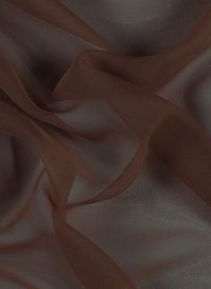 an image of a brown fabric textured with satine or chiffon material