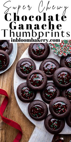 chocolate ganache thumbprints with sprinkles on a white plate and red ribbon