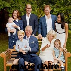 the royal family poses for a photo on a bench