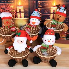 christmas decorations are sitting in baskets on a table