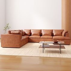 a living room filled with lots of brown furniture