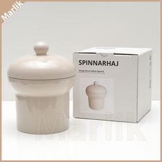 a white ceramic container with a lid next to a box for spinnari sauce