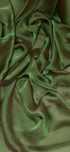 an image of a green cloth on the floor with it's fabric pulled back