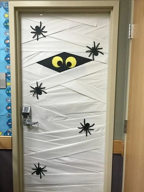 25+ DIY Halloween Classroom Door Decorations - HubPages Halloween Door Office Decorations, Front Office Halloween Decor, Door Decorating Ideas For Halloween, School Door Halloween, Decorating Classroom For Halloween, Seasonal Classroom Door Ideas, Halloween Library Door Decorations, Mummy Classroom Door, Halloween Themes For Office