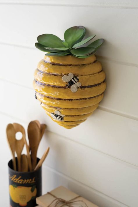 PRICES MAY VARY. Color: Yellow, Black, White Material: Glazed Ceramic Measures: 7.5" x 6" x 9"t Function: Wall Hanging Planter Decor Style: Cottage Care Instructions: Wipe with a lint-free cloth This planter is practically buzzing with style. Perfect for apiary enthusiasts or someone you think is the bee's knees. Hang on the wall for a pretty hive planter. Garden Ceramics, Ceramic Wall Planters, Wall Planters Indoor, Bee's Knees, Keyhole Hanger, Plastic Planters, Ceramic Pots, Hang On, Unique Ceramics