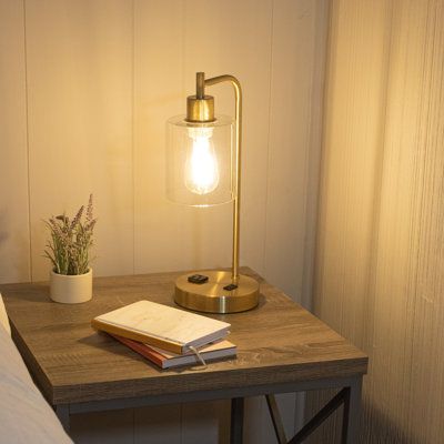 Illuminate your living room, bedroom, entryway, or home office with the Table Lamps by Lavish Home. This desk lamp features an attractive black finish with a glass shade as well as an included LED Edison lightbulb for a modern appearance in any room. The lamp for the living room comes equipped with 2 USB charging ports as well as a 2-prong AC power outlet for functional room décor and turns on/off using touch control. Use this cute lamp on your desk in your home office, beside your bed, in the h Lamp Table Bedroom, Small Gold Lamps, Lamp With Outlet, Bedroom Touch Lamps, Lamps Astetic, Light For Small Bedroom, Cute Gold Lamps, Desk Lamp With Charger, Mid Century Modern Bedroom Lamp