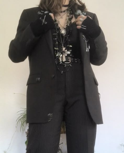 A mid-sized person/girl grey/dark green striped suit decorated with lots of oins and chains, black arm warmers, black platform dr. Martens and multiple crystal rings and bracelets. 		The person is also wearing multiple silver necklaces, a big one in form of a cross. Alt Formal Wear, Emo Prom Suit, Alt Formal Outfits, Formal Alternative Outfit, Alt Suit, Grunge Suit, Crowcore Fashion, Piratecore Fashion, Goth Suit