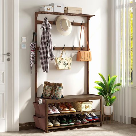 Transform your entryway with AMBIRD's versatile hall tree! Crafted with a sturdy bamboo frame, it's a 6-in-1 marvel: a shoe bench, coat rack, and storage bench all rolled into one. With 14 coat hooks and a handy cloth bag, it's designed to keep your space tidy and welcoming. Its large size ensures ample storage, while the warm brown finish complements any decor. Perfect for those who love organized elegance. #EntrywayEssential #OrganizedLiving Shoe Storage Shelving, Bench With Coat Rack, Coat Rack Shoe Bench, Shoe Bench Entryway, Shoe Rack Bench, Apartment Entryway, Shoe Storage Shelf, Shoe Shelves, Entryway Storage