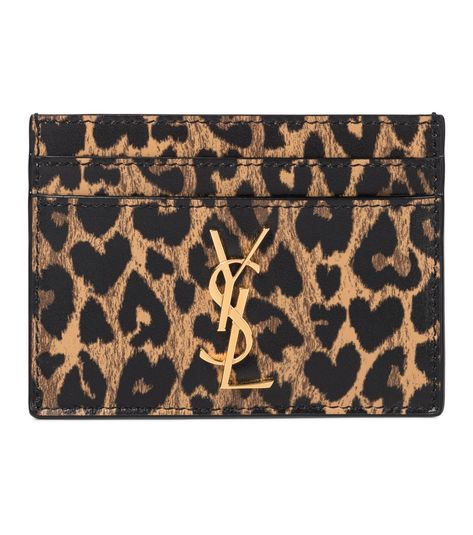 Saint Laurent - Monogram leather card holder - Make every transaction a stylish one with this leopard-print card holder from Saint Laurent. Made from supple leather, the slender style has four card slots, one larger slip pocket, and features the maison's iconic monogram logo in golden metal. seen @ www.mytheresa.com Ysl Cardholder, Ysl Card Holder, Ysl Wallet, Cute Wallets, Leather Card Holder, Birthday Wishlist, Pretty Bags, Monogrammed Leather, Essential Bag