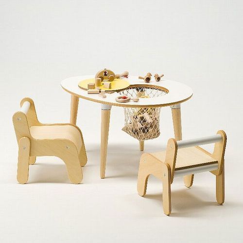 a wooden toy table with chairs and a small child's rocking horse next to it