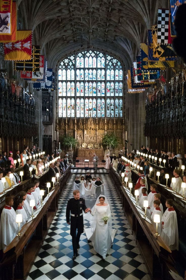 the bride and groom are walking down the aisle in their wedding ceremony at st mary's cathedral