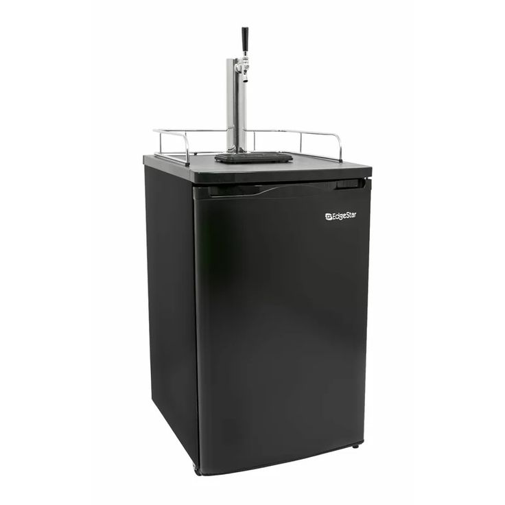 a small black refrigerator freezer sitting on top of a white wall next to a toothbrush dispenser