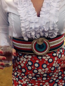 Not all women wear dresses; this frilly shirt and spotty skirt comno was complemented by a coordinating striped belt...