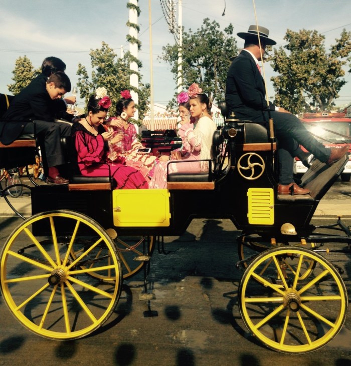 Never goes out of fashion - taking a turn around the recinto(fairground) in a carriage..