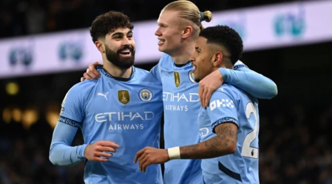 Manchester City's players celebrate scoring against West Ham 