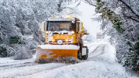 A snow plough near Knaresborough, in Yorkshire, driving through snow