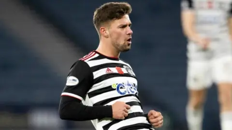 Queen's Park's Jack Turner celebrates