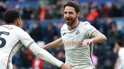 Joe Allen celebrates scoring for Swansea