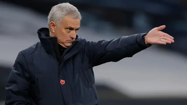 Jose Mourinho stands on the touchline