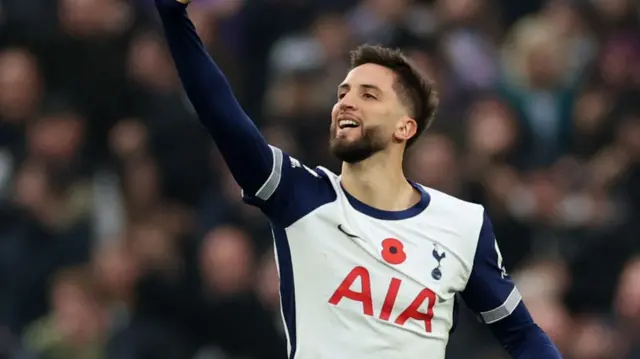 Rodrigo Bentancur signals to the Tottenham fans after scoring against Ipswich