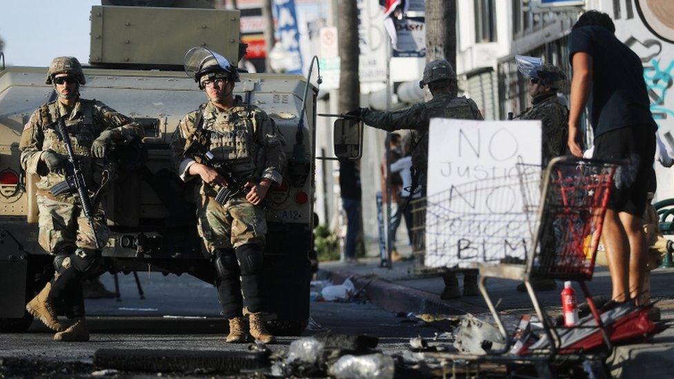 National Guard troops keep watch in the Fairfax District in California