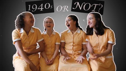 Beth, Imogen, Sienna and Zoey from Malory Towers laughing in front of a 1940s-style film background.