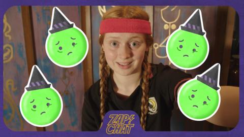 A young witch in gym kit (Mildred from The Worst Witch) looks uneasy, with green sad witch emojis around her face.