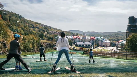 People skiing on a dry slope (Credit: Tremblant)