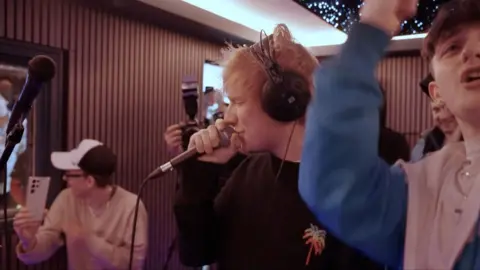 Ed Sheeran with young musicians in Belfast