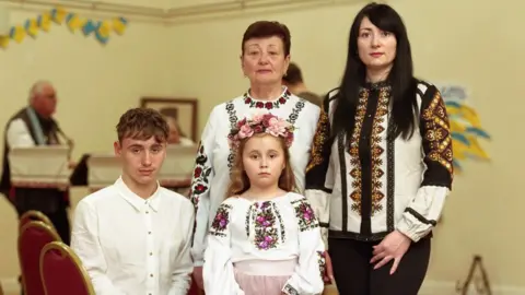 Ciaran Spencer Family portrait featuring Liudmyla Zhyhunova, her mother Olha Pidhorodetska and her two children Vladyslav and Yeva.