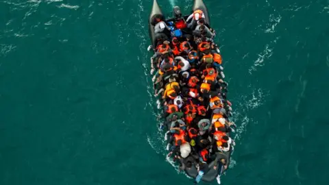 A drone view of an inflatable dinghy carrying migrants making its way towards the UK in the English Channel in August.