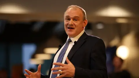 Ed Davey, leader of the Liberal Democrats, delivers a speech on British leadership on trade