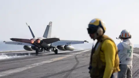 A photo, released by the US Africa Command, showing a fighter jet on a runway.