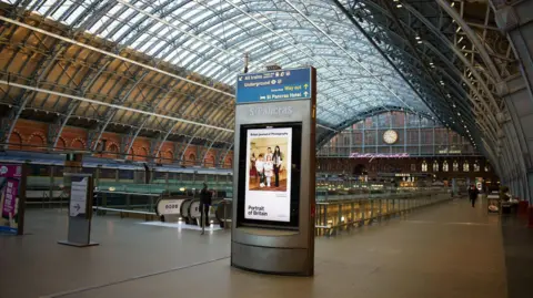 Ciaran Spencer The portrait displayed on an electronic billboard in St Pancras railway station