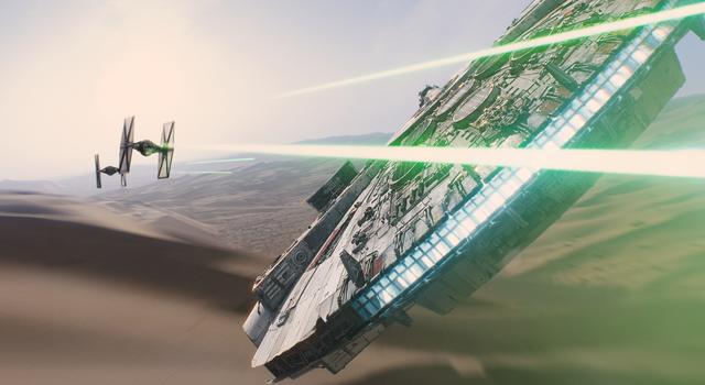 The Millennium Falcon takes on TIE fighters in a scene from 'Star Wars: The Force Awakens.'