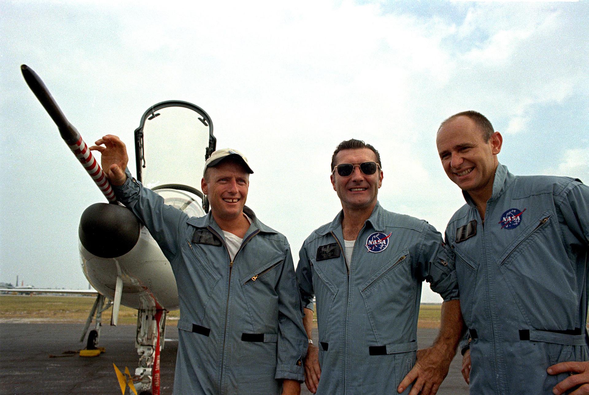 The Apollo 12 astronauts, Charles Conrad Jr., Richard F. Gordon, and Alan L. Bean, pose in front of a NASA T-38 training aircraft at Patrick Air Force Base. 