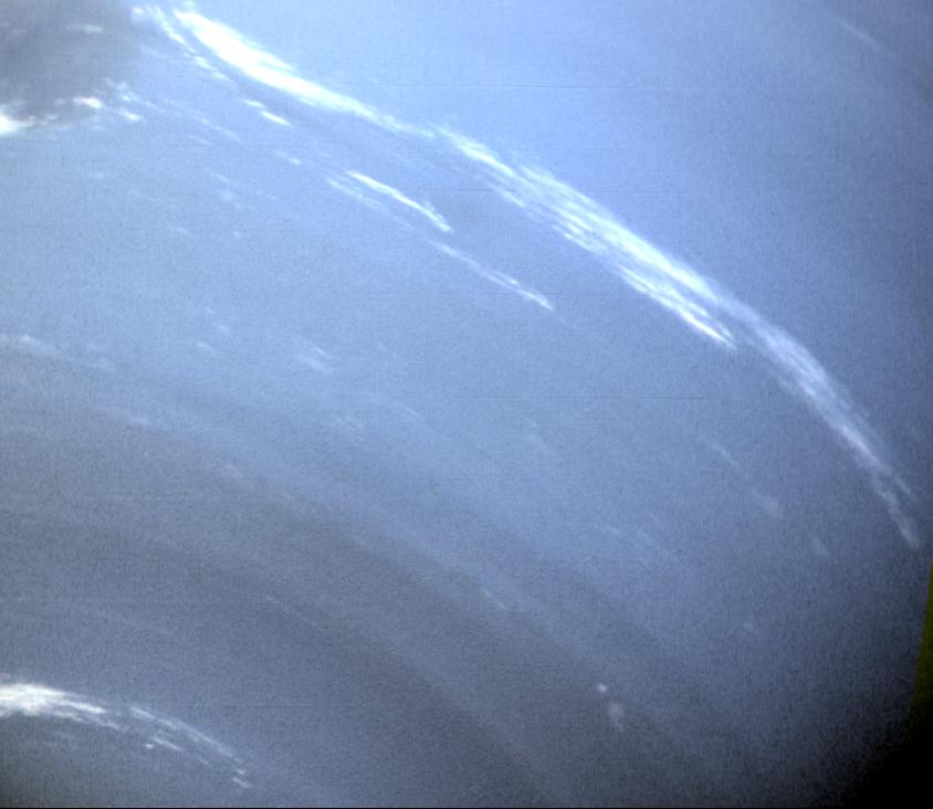 This image of Neptune was taken by NASA Voyager 2 wide-angle camera; small trails of similar clouds trending east to west and large scale structure east of the Great Dark Spot all suggest that waves are present in the atmosphere and play a large role 