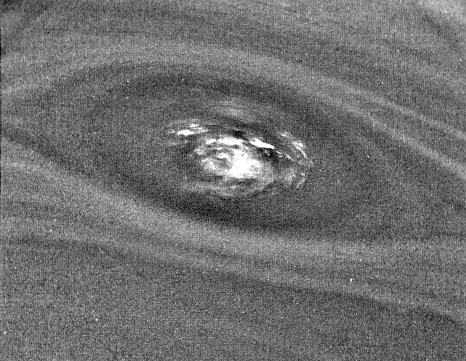 This bulls-eye view of Neptune small dark spot D2 was obtained by NASA Voyager 2 narrow-angle camera. Banding surrounding the feature indicates unseen strong winds.